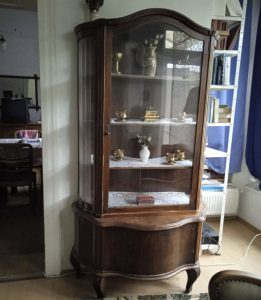 Antique display case with spacious shelf storage under the glass part