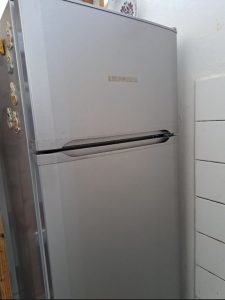 Refrigerator with freezer above