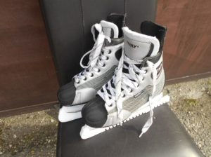 men's skates no. 45, on ice