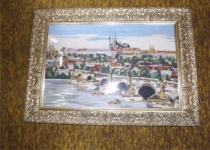 Embroidered picture of Hradčany in a beautiful gold frame.