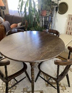 Wooden dining table with 6 brown chairs for sale