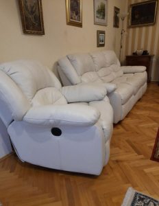 Leather sofa + armchair with electrically opening footrest