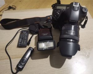 I am selling a Sony a77ii SLR camera + lens + grip + flash.