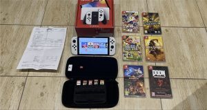 Nintedo Switch OLED + 13 games, new console condition