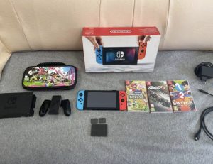 Nintendo Switch + Splatoon 2 tok + Super Mario Bros U Deluxe, Motogp18